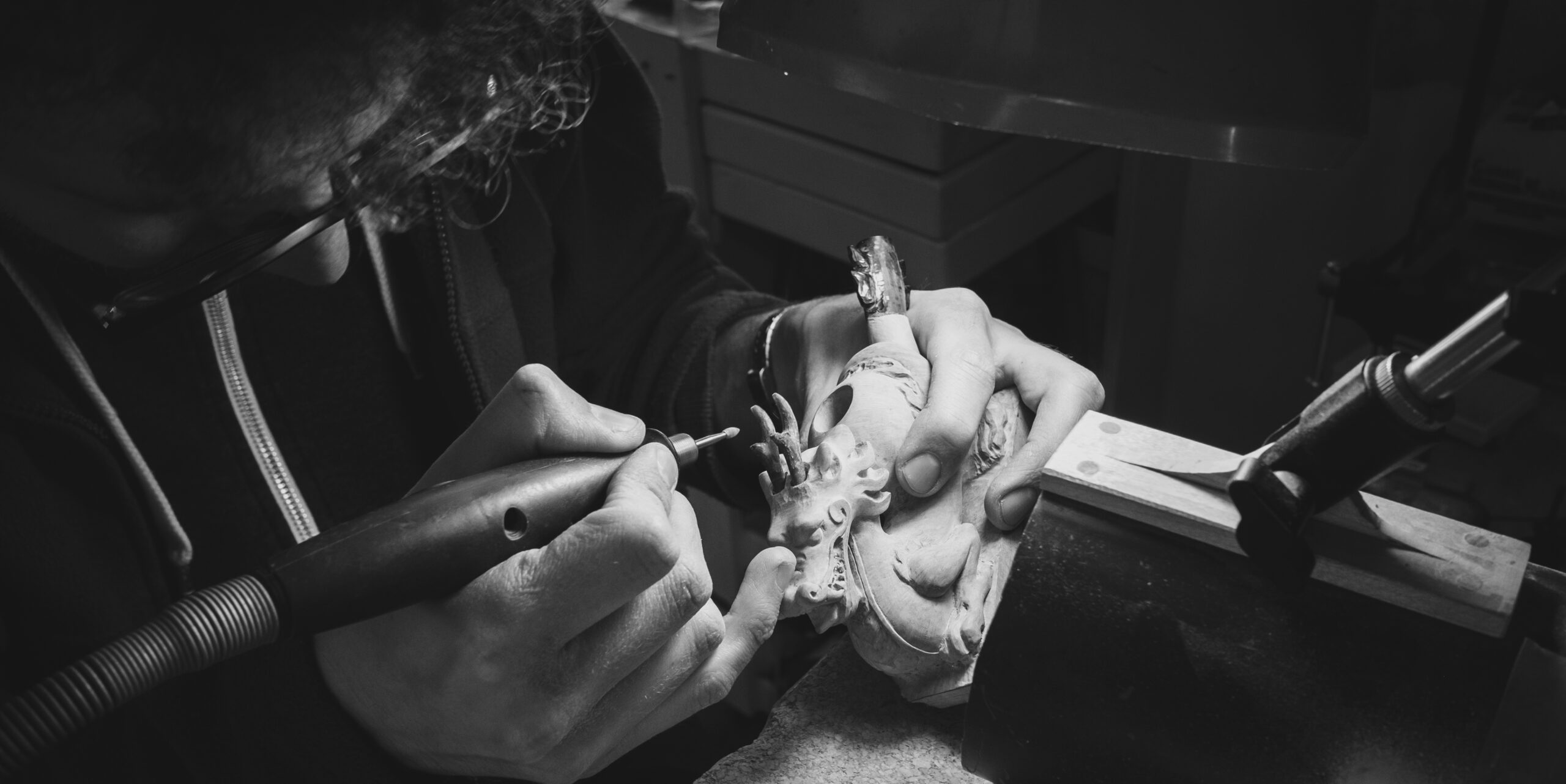 Arcangelo ambrosi carving a sculptural dragon pipe