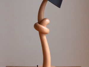 Knotted lamp, a hand-carved wooden lamp with a knotted stem. Designed and crafted by Arcangelo Ambrosi