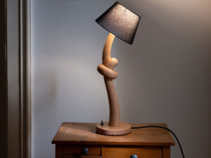 Knotted lamp, a hand-carved wooden lamp with a knotted stem. Designed and crafted by Arcangelo Ambrosi
