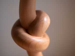 Knotted lamp, a hand-carved wooden lamp with a knotted stem. Designed and crafted by Arcangelo Ambrosi