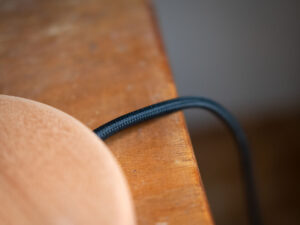 Knotted lamp, a hand-carved wooden lamp with a knotted stem. Designed and crafted by Arcangelo Ambrosi