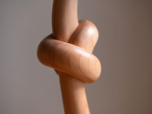 Knotted lamp, a hand-carved wooden lamp with a knotted stem. Designed and crafted by Arcangelo Ambrosi