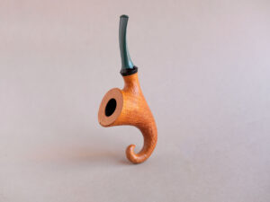 Pixie, a signature model pipe made of snadblasted briar with a green stem, created by Arcangelo Ambrosi