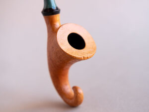 Pixie, a signature model pipe made of snadblasted briar with a green stem, created by Arcangelo Ambrosi
