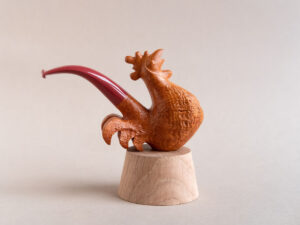 Singing rooster sculptural pipe crafted by Arcangelo Ambrosi and made of natural sandblasted briar and red ebonite stem