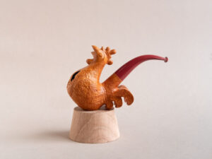 Singing rooster sculptural pipe crafted by Arcangelo Ambrosi and made of natural sandblasted briar and red ebonite stem