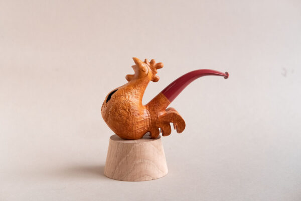 Singing rooster sculptural pipe crafted by Arcangelo Ambrosi and made of natural sandblasted briar and red ebonite stem