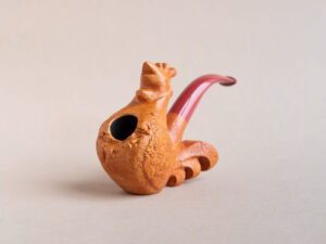 Singing rooster sculptural pipe crafted by Arcangelo Ambrosi and made of natural sandblasted briar and red ebonite stem