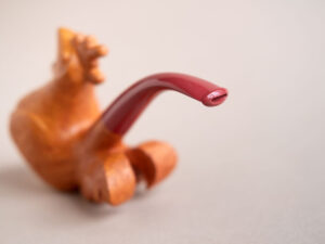 Singing rooster sculptural pipe crafted by Arcangelo Ambrosi and made of natural sandblasted briar and red ebonite stem