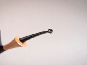 Pickaxe shaped smoking pipe. handmade of briar stained black and with boxwood shank. Ebonite stem.